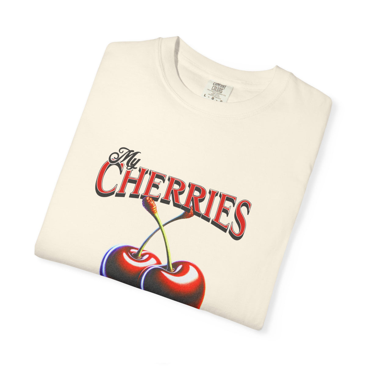 Cream oversized vintage-style t-shirt featuring a bold graphic of two red cherries and the text “My Cherries Are My Business.” A flirty and confident design perfect for making a bold statement.

