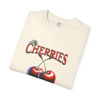 Cream oversized vintage-style t-shirt featuring a bold graphic of two red cherries and the text “My Cherries Are My Business.” A flirty and confident design perfect for making a bold statement.
