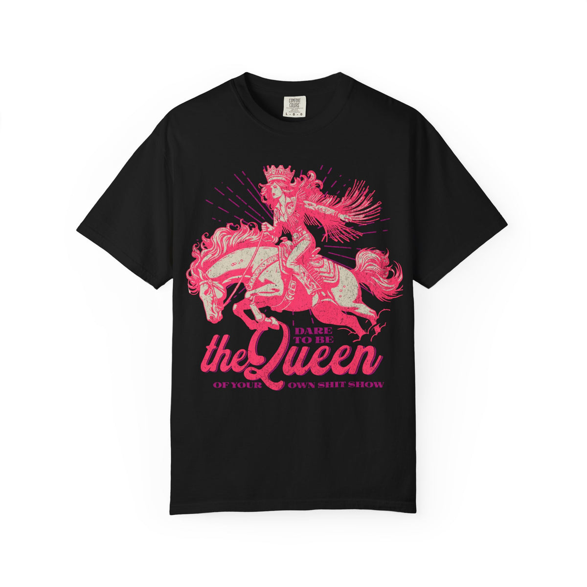 Black oversized t-shirt featuring a bold pink graphic of a cowgirl wearing a crown and fringe, riding a horse. Text reads “Dare to be the Queen of your own sh*t show.” Western-inspired, empowering design with a humorous twist.
