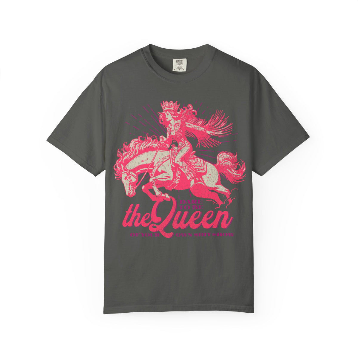 Black oversized t-shirt featuring a bold pink graphic of a cowgirl wearing a crown and fringe, riding a horse. Text reads “Dare to be the Queen of your own sh*t show.” Western-inspired, empowering design with a humorous twist.
